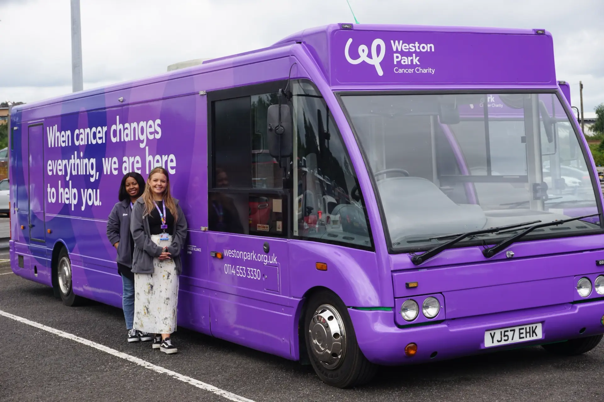 A big purple bus with the Weston park charity logo